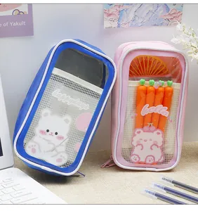 Detail view of pink and blue cute transparent pencil cases decorated with cartoon bear prints
