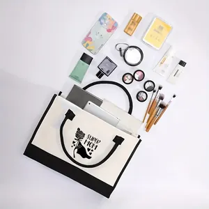 Detail view of large capacity canvas tote bag with various daily essentials.