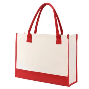 Large canvas tote bag with red handles and trim for shopping and travel