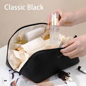 Large capacity black concertina cosmetic bag for travel and professional storage