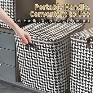 Large houndstooth laundry storage bin with handles for blankets and clothes.