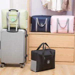 High-capacity foldable travel duffle bag with suitcase handle strap in multiple colors