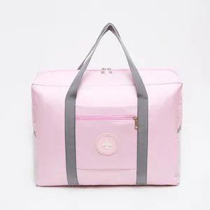 Durable pink foldable travel bag with trolley sleeve and airplane logo for gym or travel
