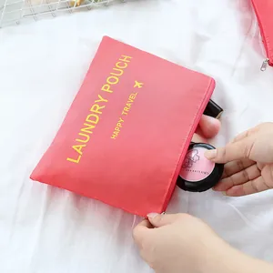 Pink Oxford cloth laundry pouch for travel organization and clothes storage solution