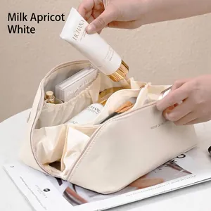 Large capacity travel cosmetic organizer bag in creamy white accordion pillow design