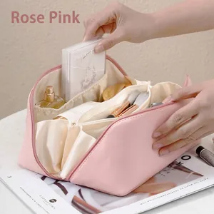 Large capacity rose pink accordion cosmetic bag with compartments for travel storage