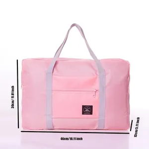 Detailed view of pink waterproof foldable travel bag with 46x30x13cm size annotations