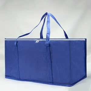 Detailed view of a large blue waterproof PE moving bag with long handles and zipper closure