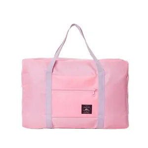 Large capacity pink waterproof foldable travel bag with lavender straps and front pocket