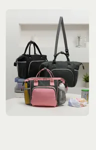 Large capacity insulated diaper bags in various colors for stylish baby gear organization.