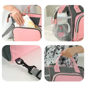 Large pink insulated diaper bag for moms with bottle pockets and adjustable strap