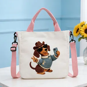 Detailed view of the unique 3D dachshund embroidery on this white canvas tote bag
