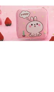 Close-up detail of a pink portable storage bag with a cute cartoon bunny illustration.