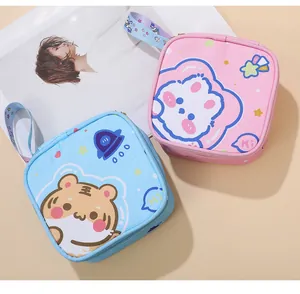 Detail view of cute cartoon animal portable sanitary napkin storage bags in pink and blue.