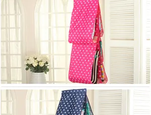Multi-layer hanging handbag organizer with pink and navy polka dots for closet storage