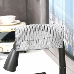 Quick-drying gray steel wire mesh dishcloth for kitchen cleaning hanging on faucet