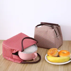 Bolsa de almuerzo aislada a rayas con asas portátiles para estudiantes