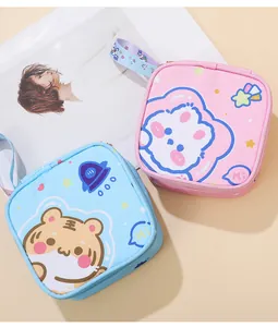 Close-up of two cute portable sanitary napkin storage bags with cartoon animal patterns.