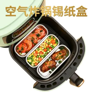 Set of rectangular aluminum foil trays for air fryer use, shown with cooked food inside
