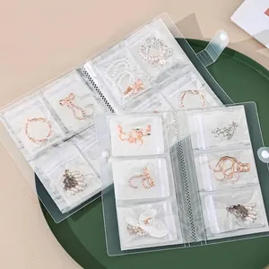 Libro organizador de joyas transparente antioxidación con múltiples bolsas de PVC