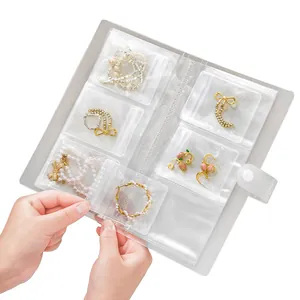 Álbum transparente portátil de joyas para pendientes y anillos con bolsas de cierre