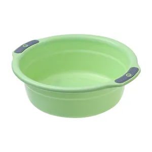 Durable green plastic washbasin with non-slip handles for home and dorm use.