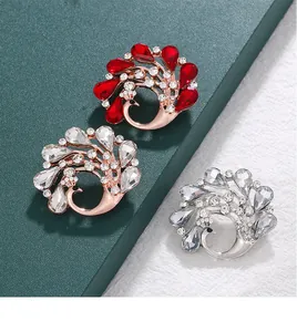 Detailed view of elegant peacock brooches adorned with colorful sparkling crystal stones