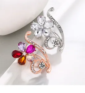 Macro view of colorful crystal flower brooches with intricate rhinestone detailing