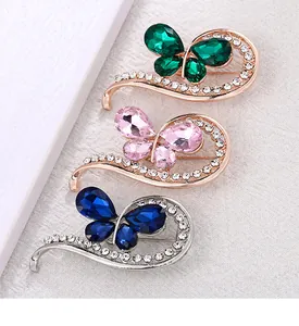 Set of three crystal butterfly brooches in green, pink, and blue rhinestone finishes