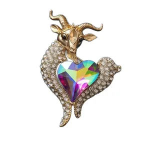 Exquisite golden goat brooch with iridescent heart crystal and sparkling rhinestones.