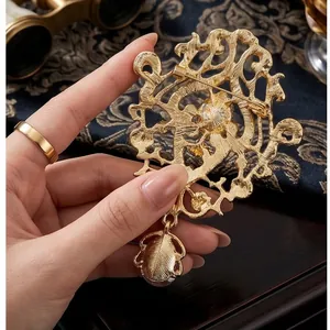 Vintage European court style golden brooch with intricate hollow design