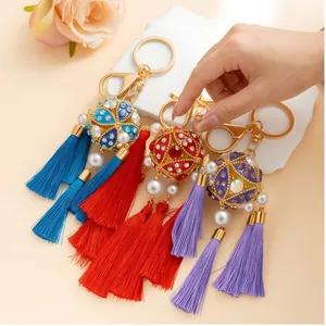 Detailed close-up of handmade traditional Chinese style keychains with colorful tassels.