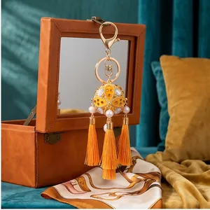 Detailed view of a traditional Chinese hydrangea tassel keychain with white pearls
