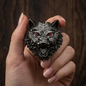 Detailed vintage metallic wolf head brooch for men featuring striking red eye accents