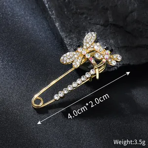 Detailed view of rhinestone dragonfly safety pin brooch with 4.0x2.0cm dimensions