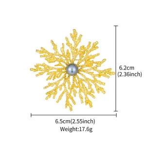 Detailed view of gold snowflake brooch with pearl, dimensions 6.5x6.2cm, weight 17.6g