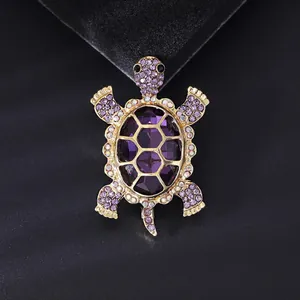 High-end animal brooch featuring a golden turtle with purple crystals and stones