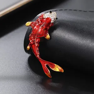 Elegant red enamel koi fish brooch with a sparkling crystal pave head on alloy