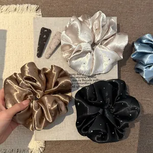 Satijnen scrunchies met fonkelende strass-steentjes in champagne, brons en zwart