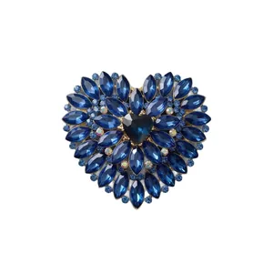 Luxurious vintage heart-shaped brooch with sparkling dark blue crystals and rhinestones