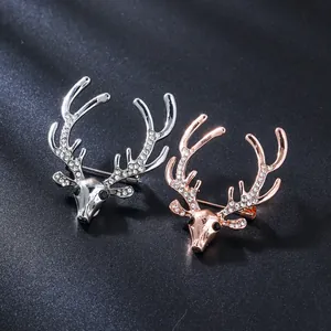 Detail view of elegant deer head brooches with crystal embellishments in two finishes.