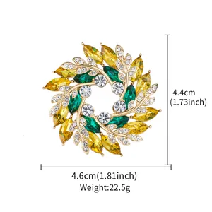 Detail view of floral wreath brooch with yellow and green crystals and dimensions