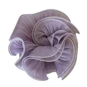 Elegant large pearlized lavender satin scrunchie with pleated flower-like design for buns