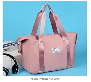 Detail shot of the large capacity pink travel bag with durable handles and label