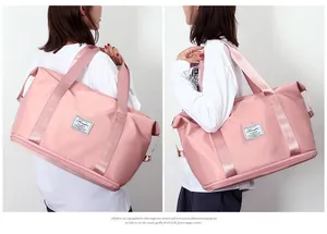 Pink expandable travel bag for women shown on model for size reference