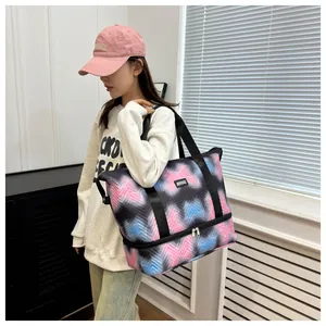 Large colorful patterned travel tote bag featuring a bottom zipper shoe compartment.