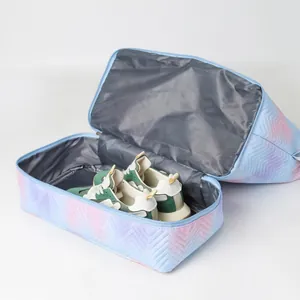 Pastel gradient foldable travel storage bag with chevron quilting and shoes inside