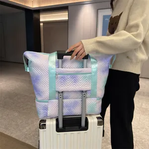 Expandable chevron quilted travel bag with trolley sleeve in purple and green gradient finish