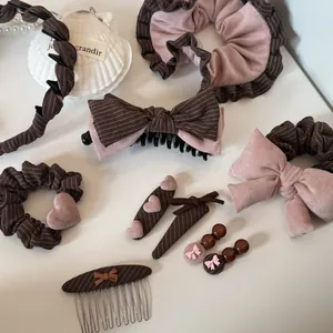 Brown striped and dusty pink hair accessory collection set details