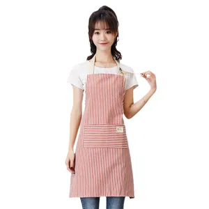 Modern red and white vertical striped kitchen apron with front pocket shown on model